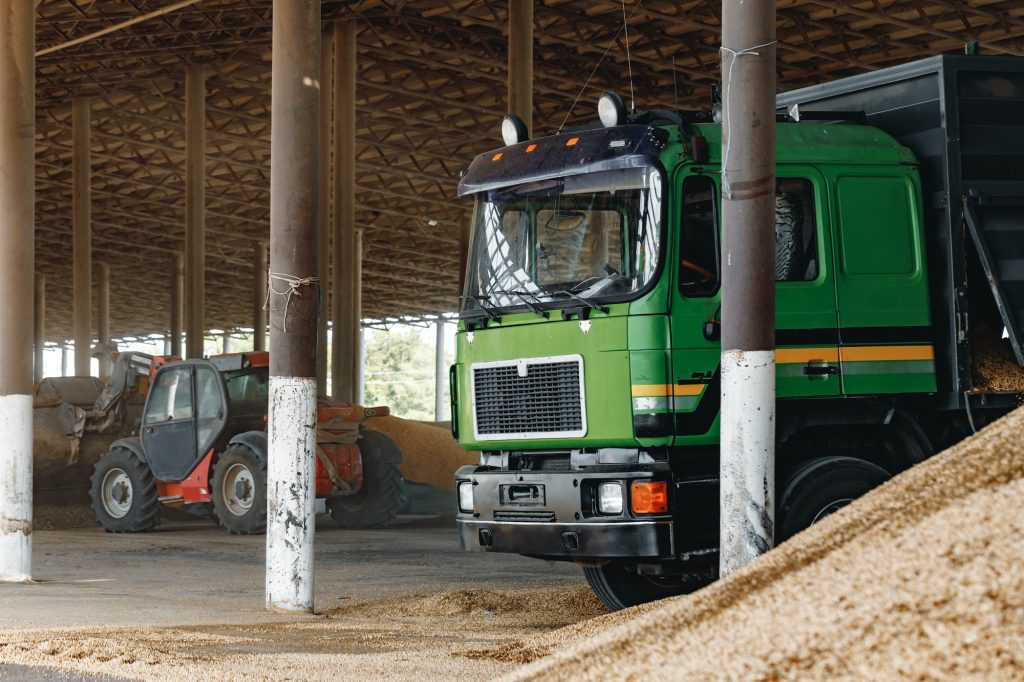 Truck and tractor on a farm parking