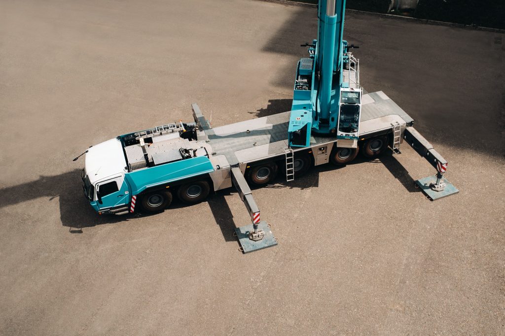view from the height of the Car heavy crane that stands open in the Parking lot and ready to work